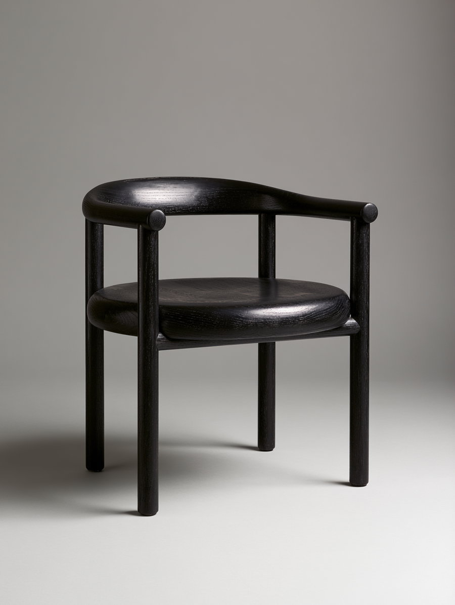 A modern black wooden chair featuring cylindrical legs and a rounded backrest, placed on a neutral background.