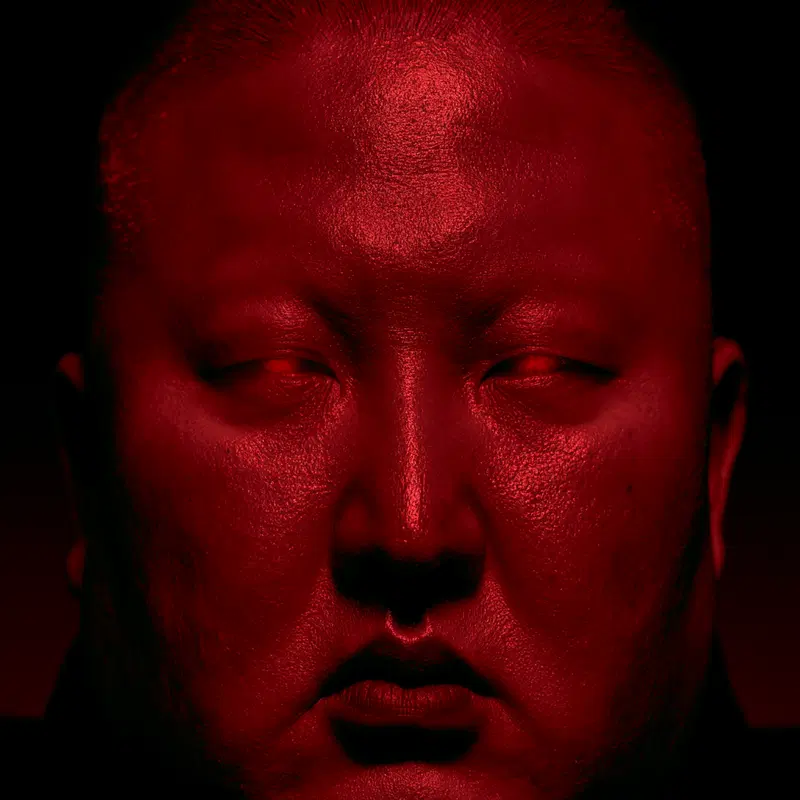 Close-up portrait of a person with red light and eerie mood