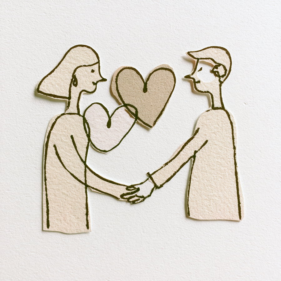 Paper cutouts of a man and woman holding hands with two hearts between them on a textured white background