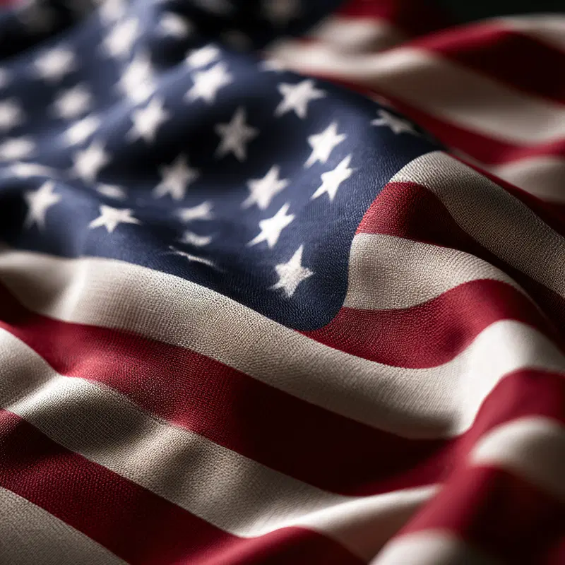 Close-up photograph of detailed texture on a wrinkled American flag
