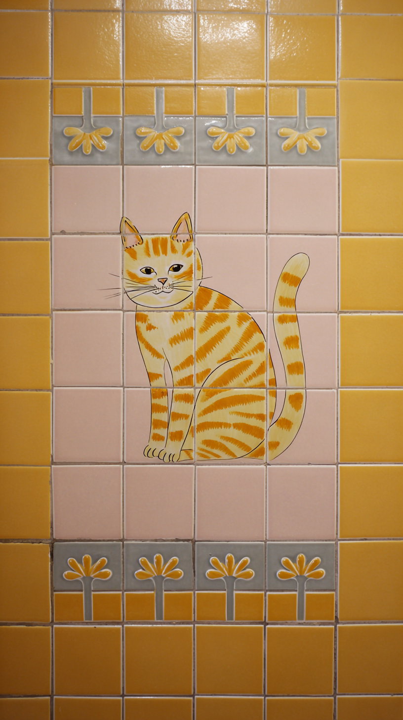 Cat-themed bathroom tiles in a stylish modern bathroom