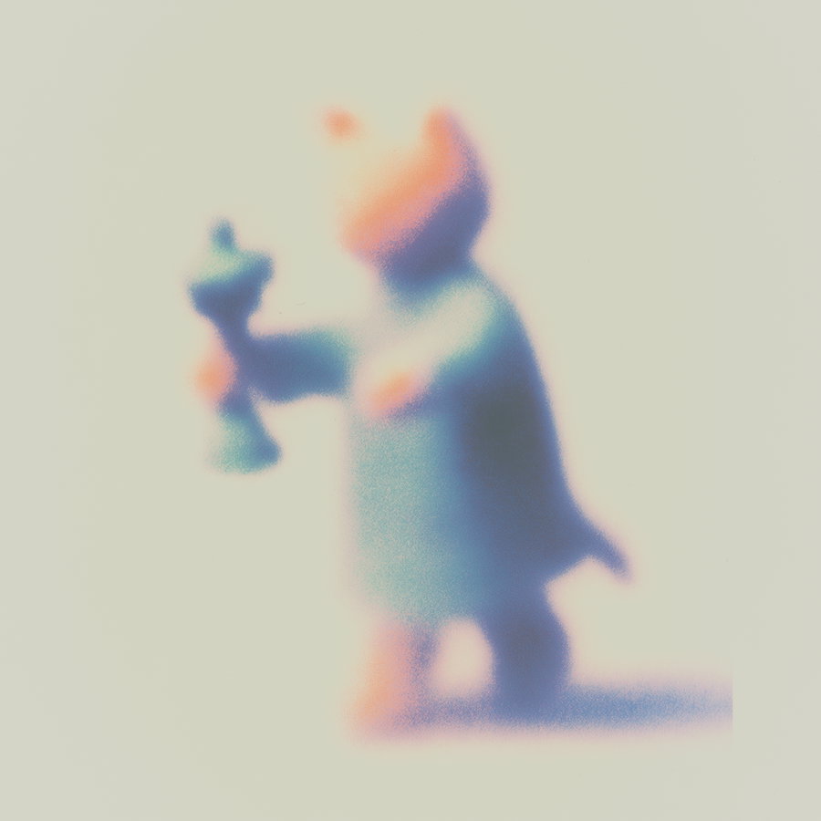 Cute orange cat holding pepper grinder in pastel tones