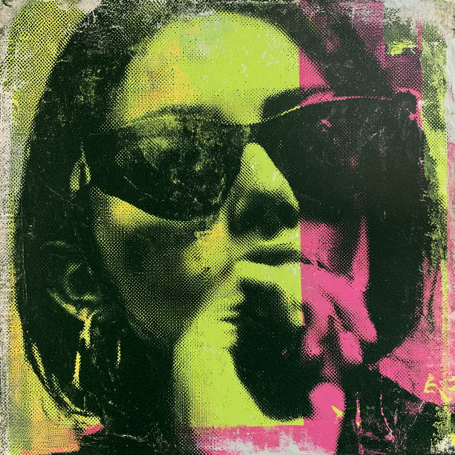 Artistic image of a woman's face featuring halftone dots and split vibrant colors including yellow and pink, wearing sunglasses and large earrings
