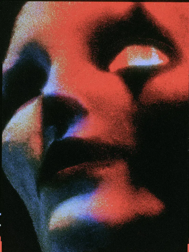 Close-up portrait with abstract red and blue lighting effects