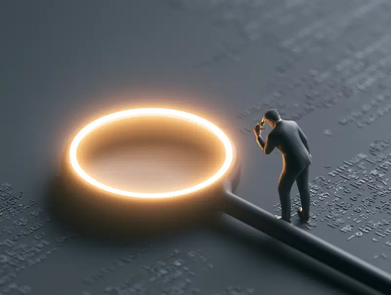 Man examining text with a glowing magnifying glass in a dark setting