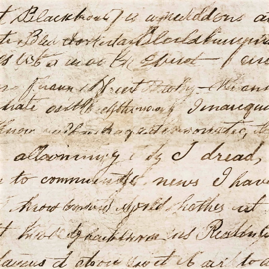Old paper with cursive handwritten text in sepia ink, showing faded and worn areas