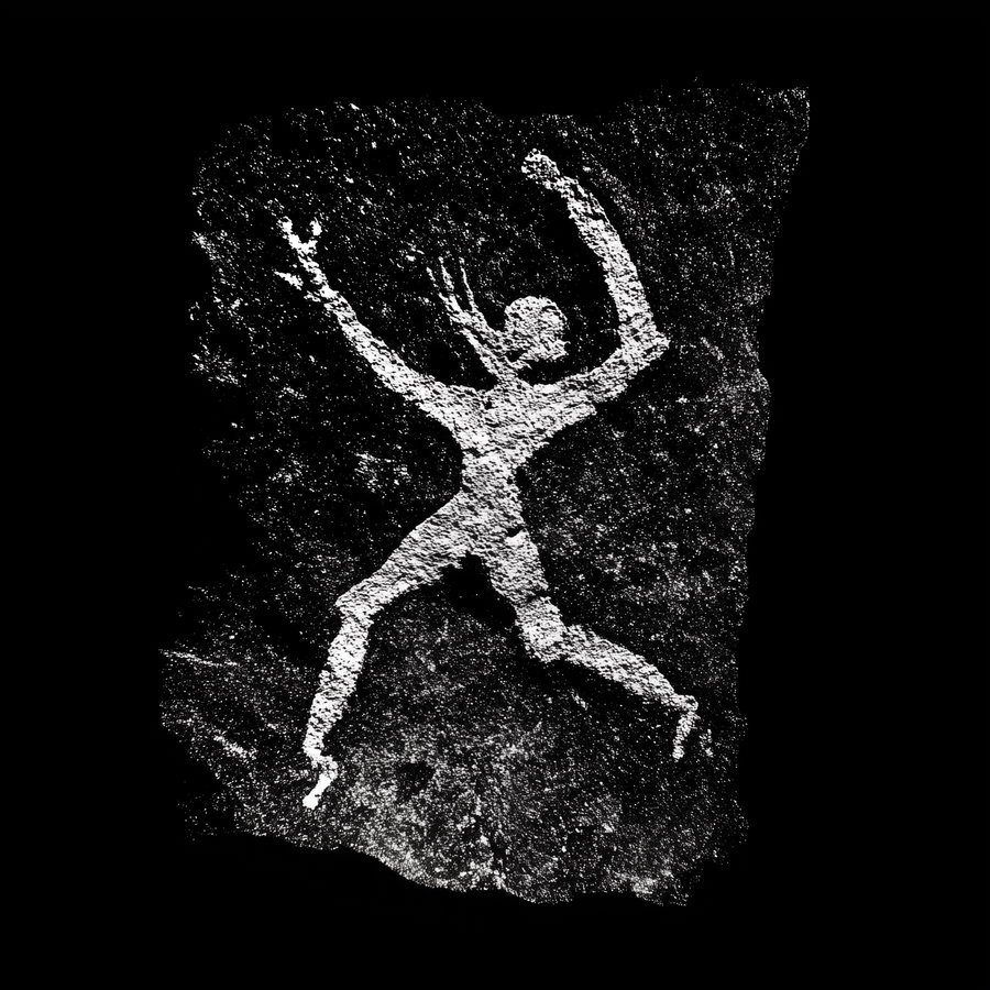 Ancient drawing of a white dancing figure on black background