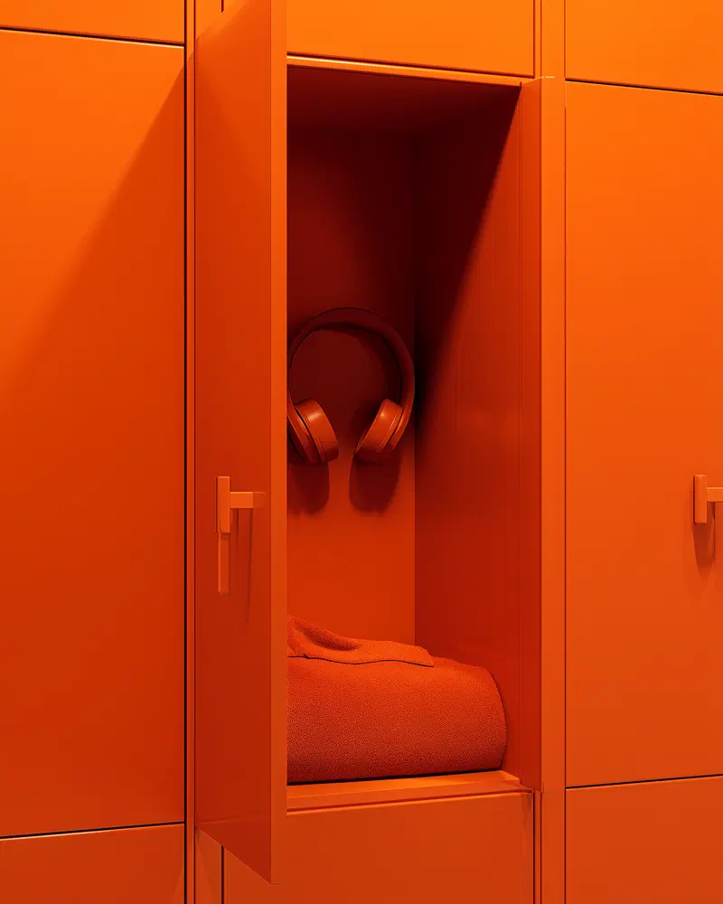Minimalist still life composition with headphones and folded towel in orange locker