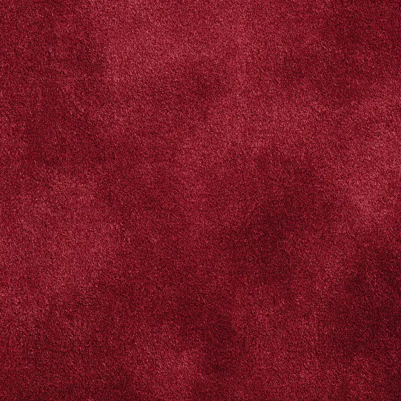 Close-up of rich red textured surface with subtle variations