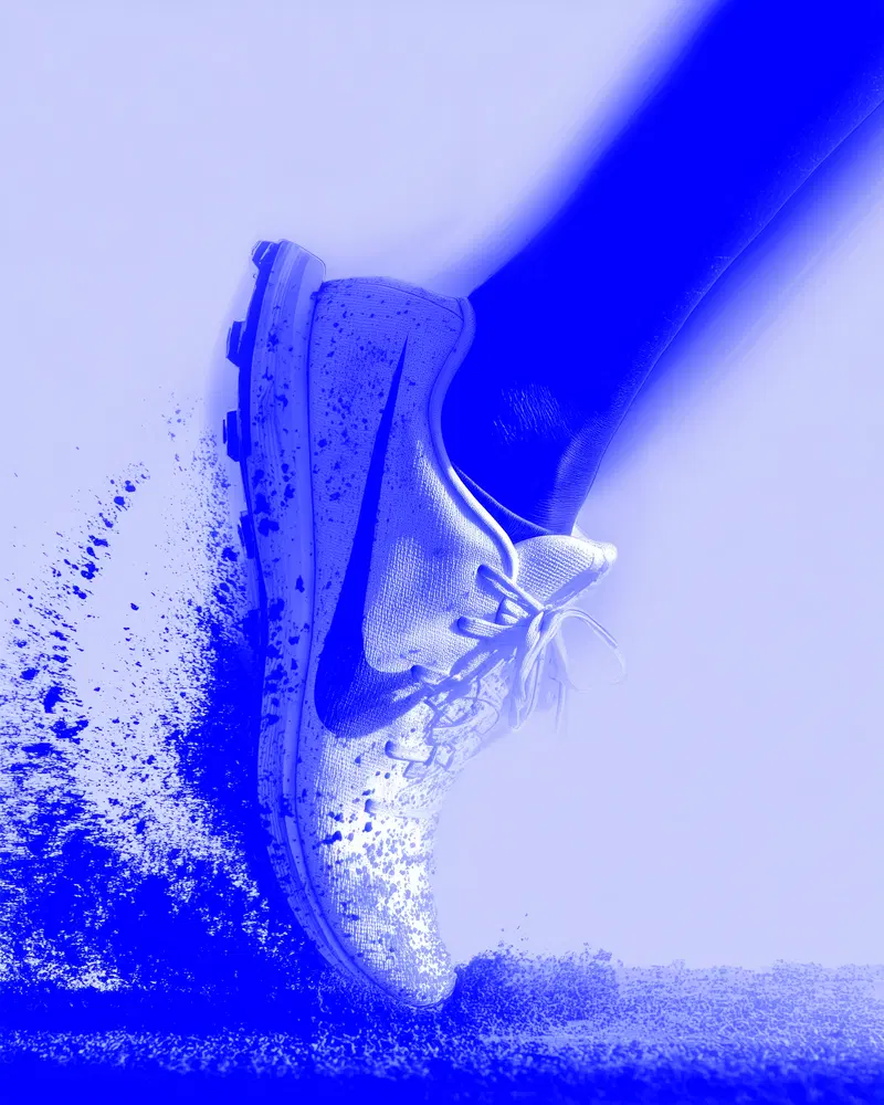 Digital illustration of a sneaker kicking up dust in motion